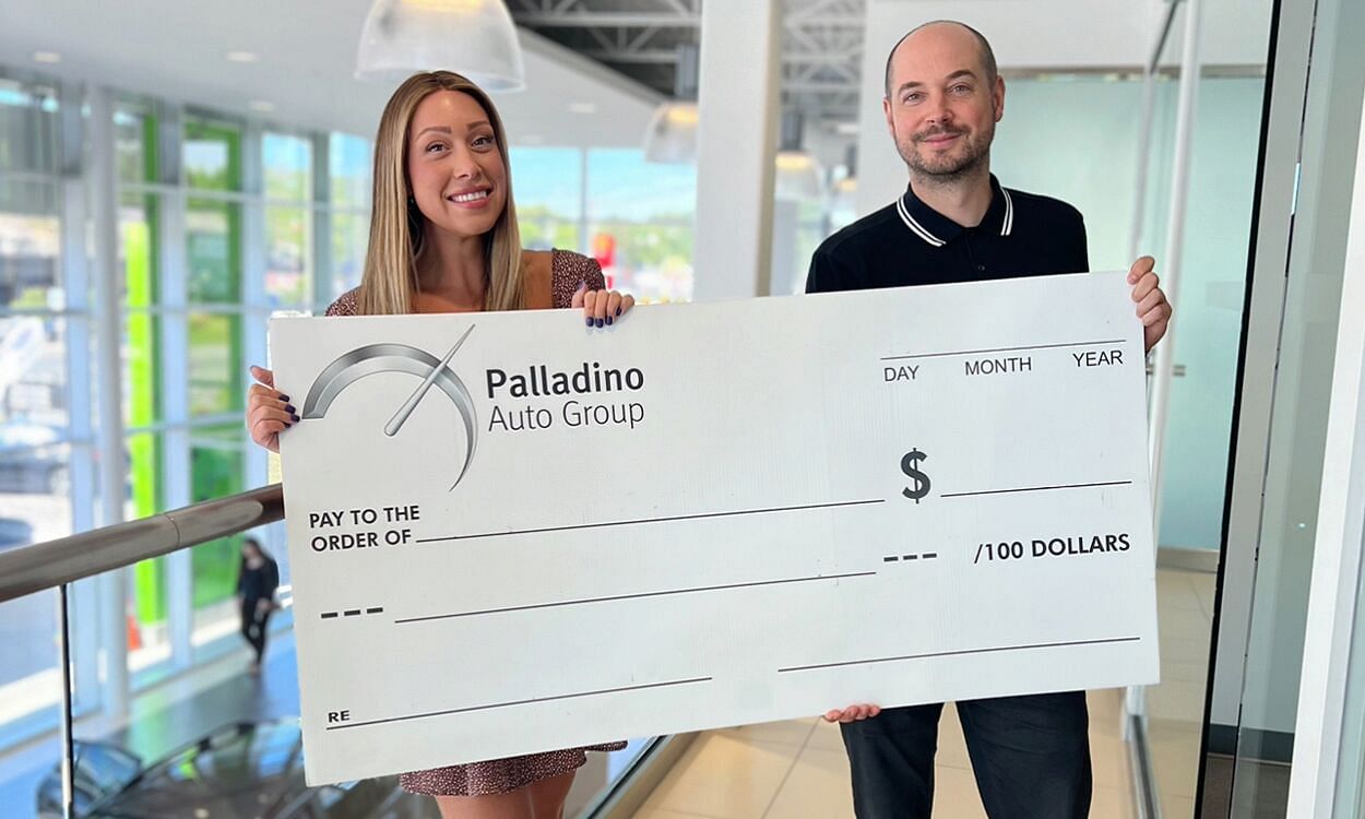 two people holding the check